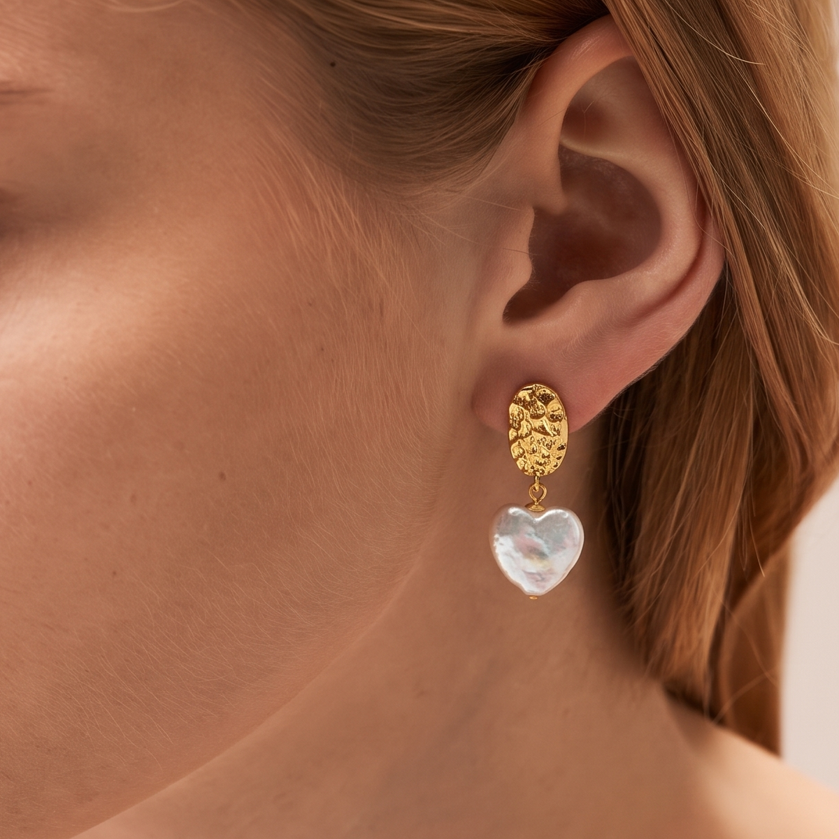 Amour Baroque Pearl Heart Earrings by ORAÉ — close-up shot