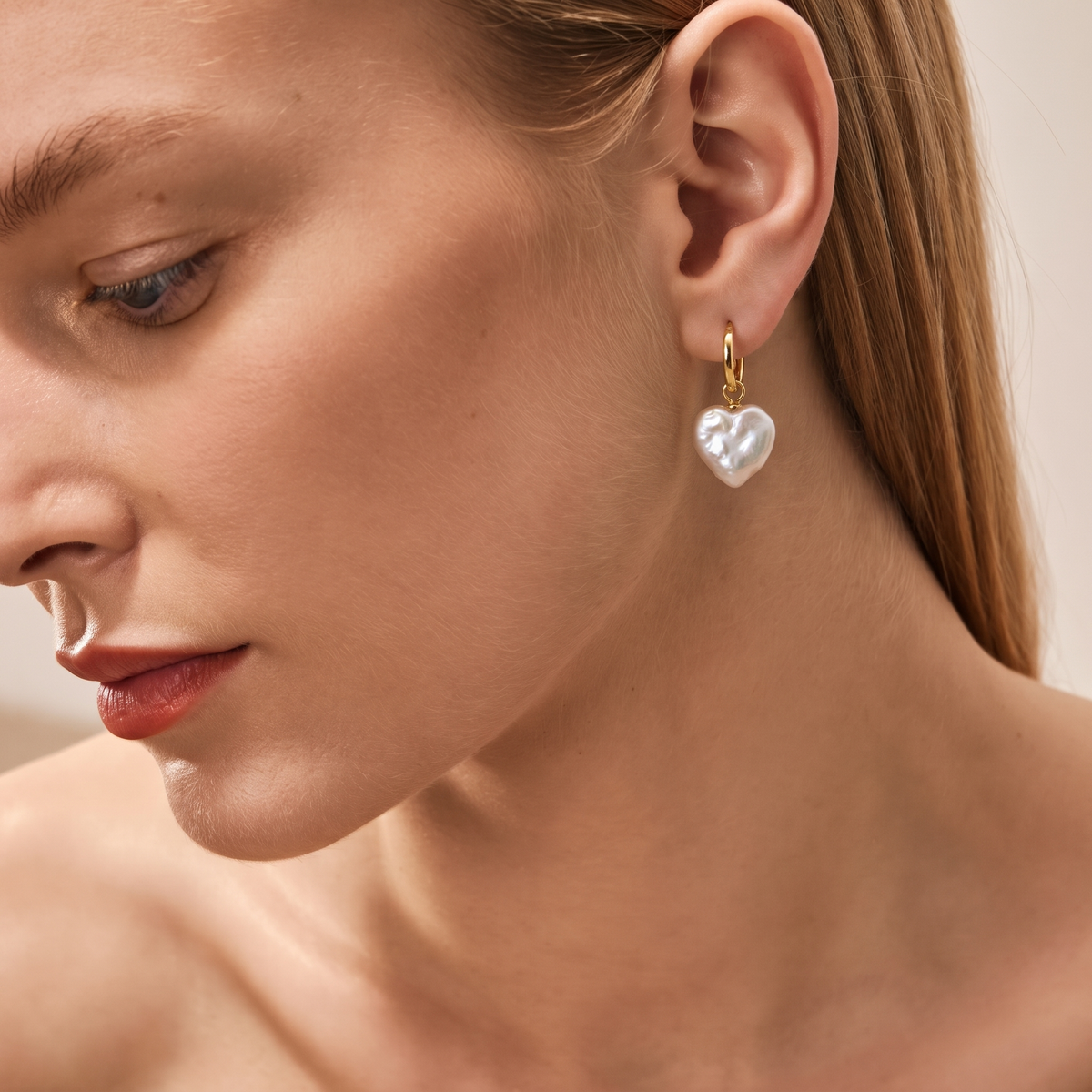 Amour Baroque Heart Pearl Earrings by ORAÉ — close-up shot