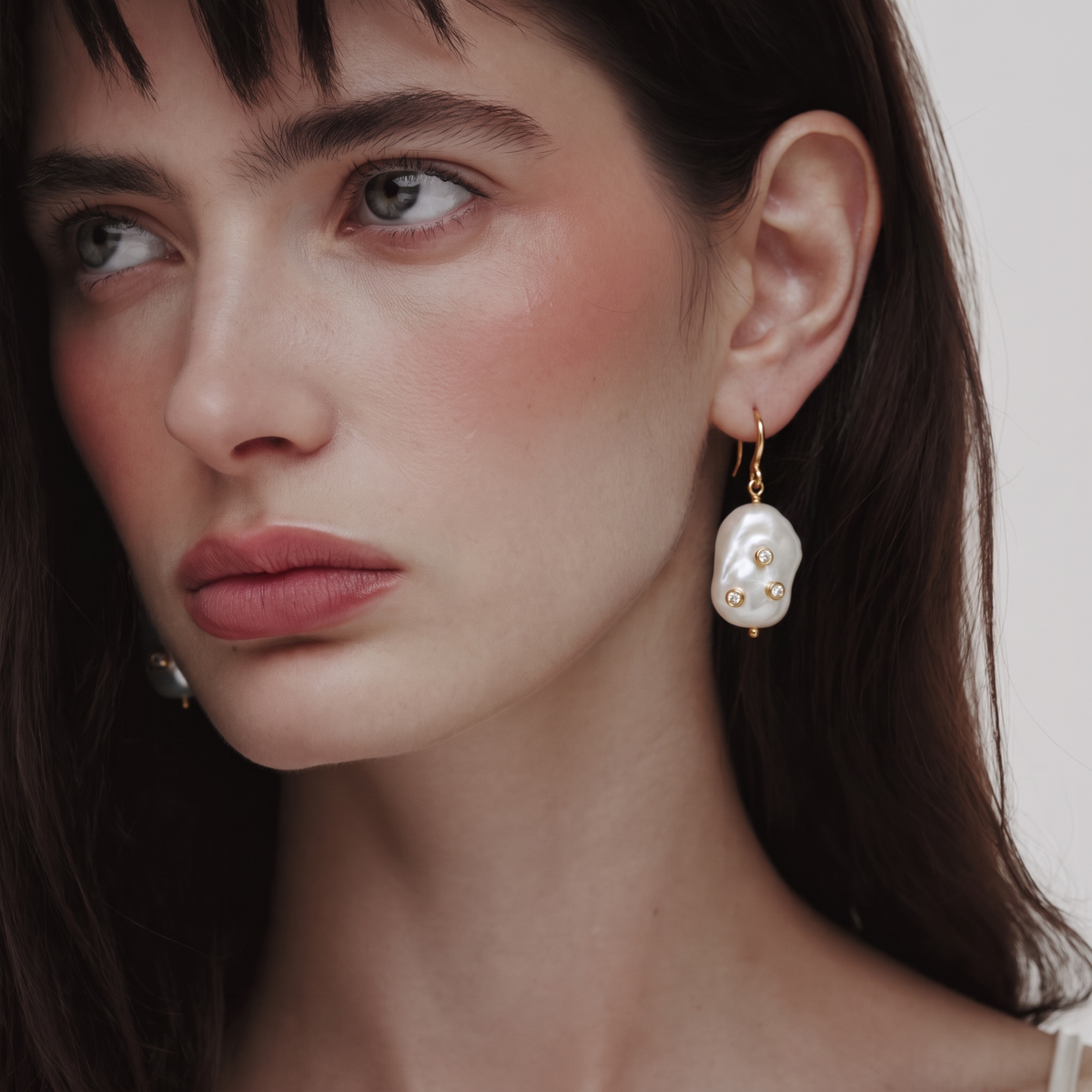 Constellation Baroque Pearl Drop Earrings by ORAÉ — close-up shot
