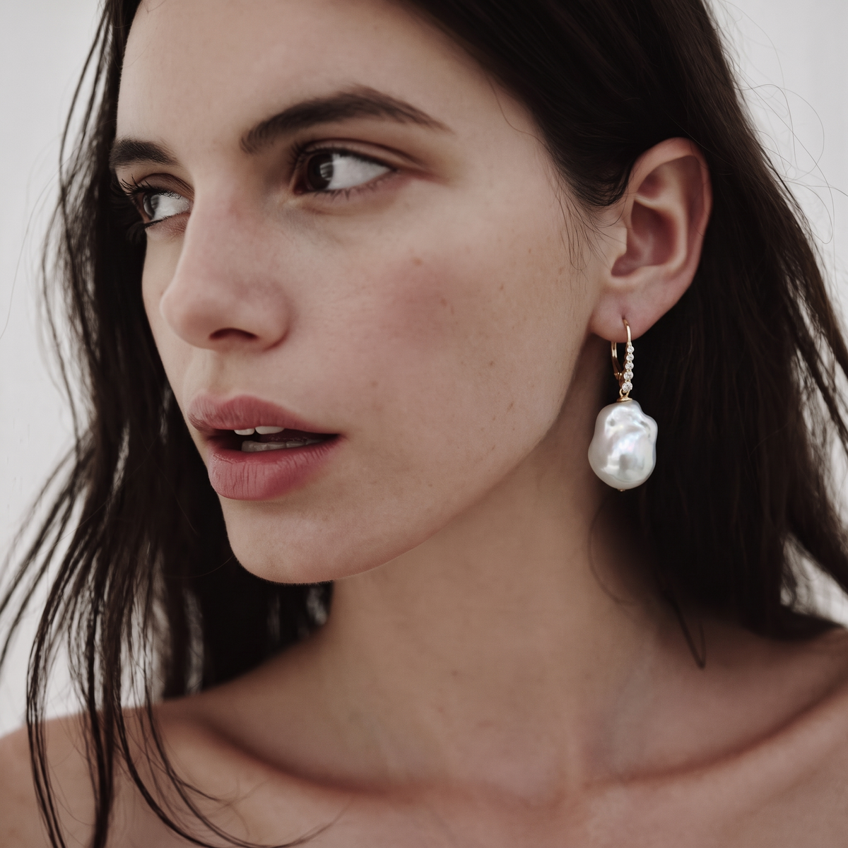 Rosalie Baroque Pearl Drop Earrings by ORAÉ — close-up shot