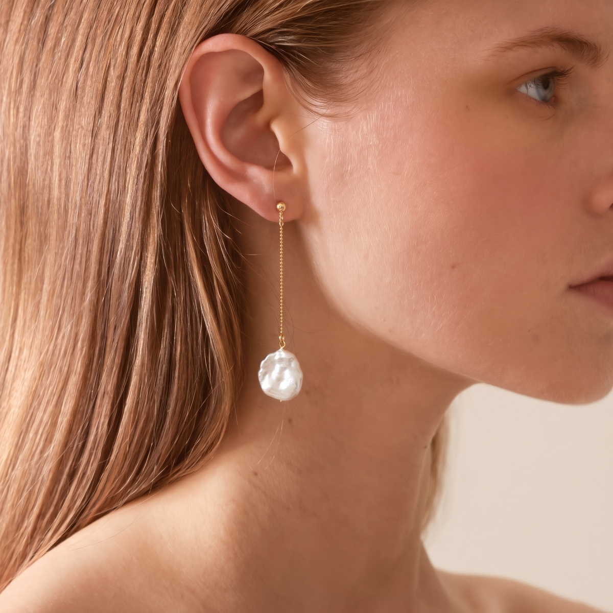 Petal Pearl Drop Earrings by ORAÉ — close-up shot