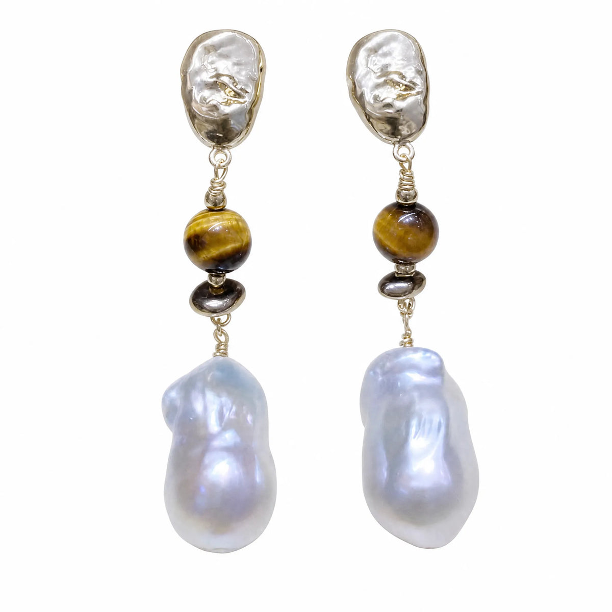 Pair of tiger eye and baroque pearl drop earrings, flat lay on white background